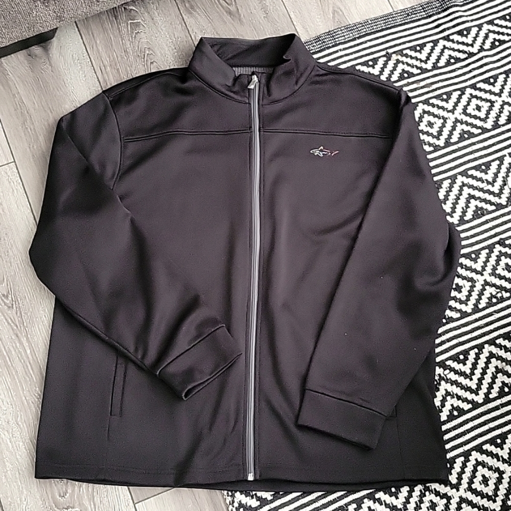 Men's Greg Norman black zip up jacket.